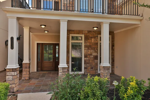 front view of a building with a potted plant