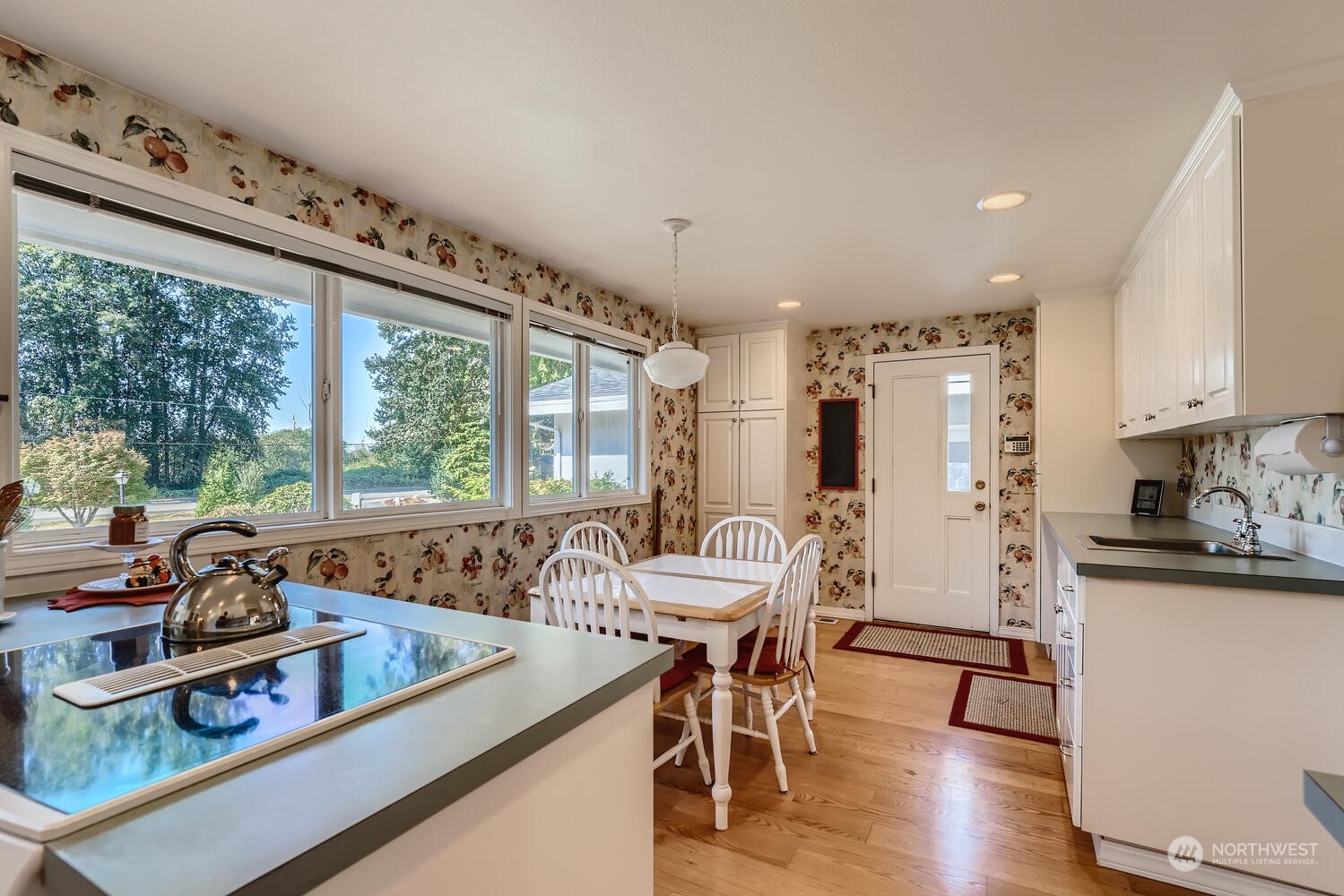 12823 Spanaway Loop Road South Tacoma, WA 98444 - Photo 12 of 38 a view of a dining room with furniture window and wooden floor