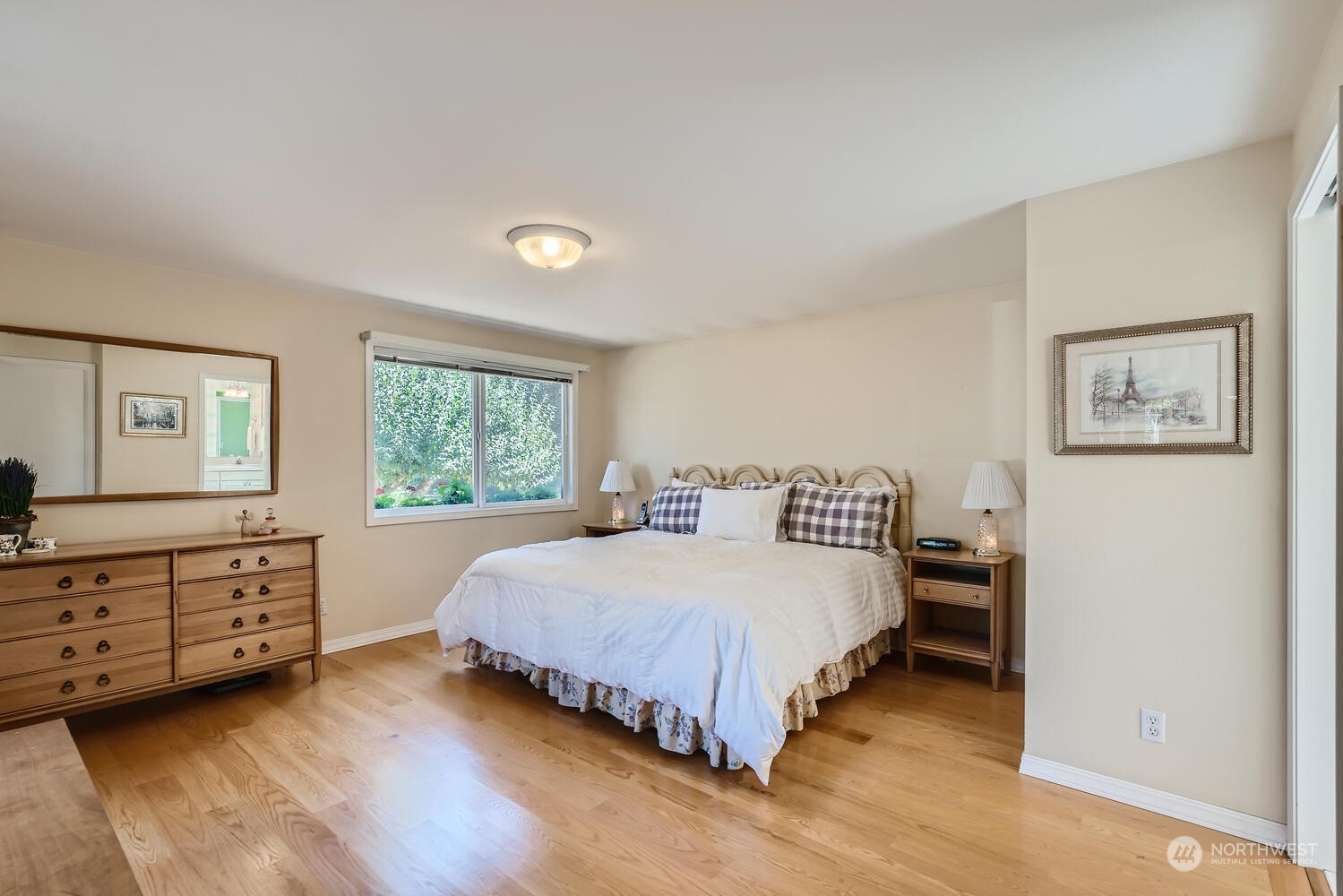 12823 Spanaway Loop Road South Tacoma, WA 98444 - Photo 15 of 38 a bedroom with a bed and a dresser