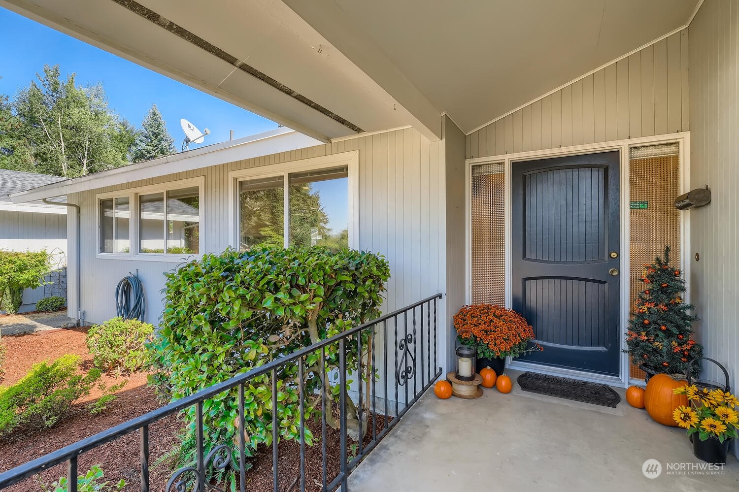 12823 Spanaway Loop Road South Tacoma, WA 98444 - Photo 3 of 38 a view of a porch with a bench