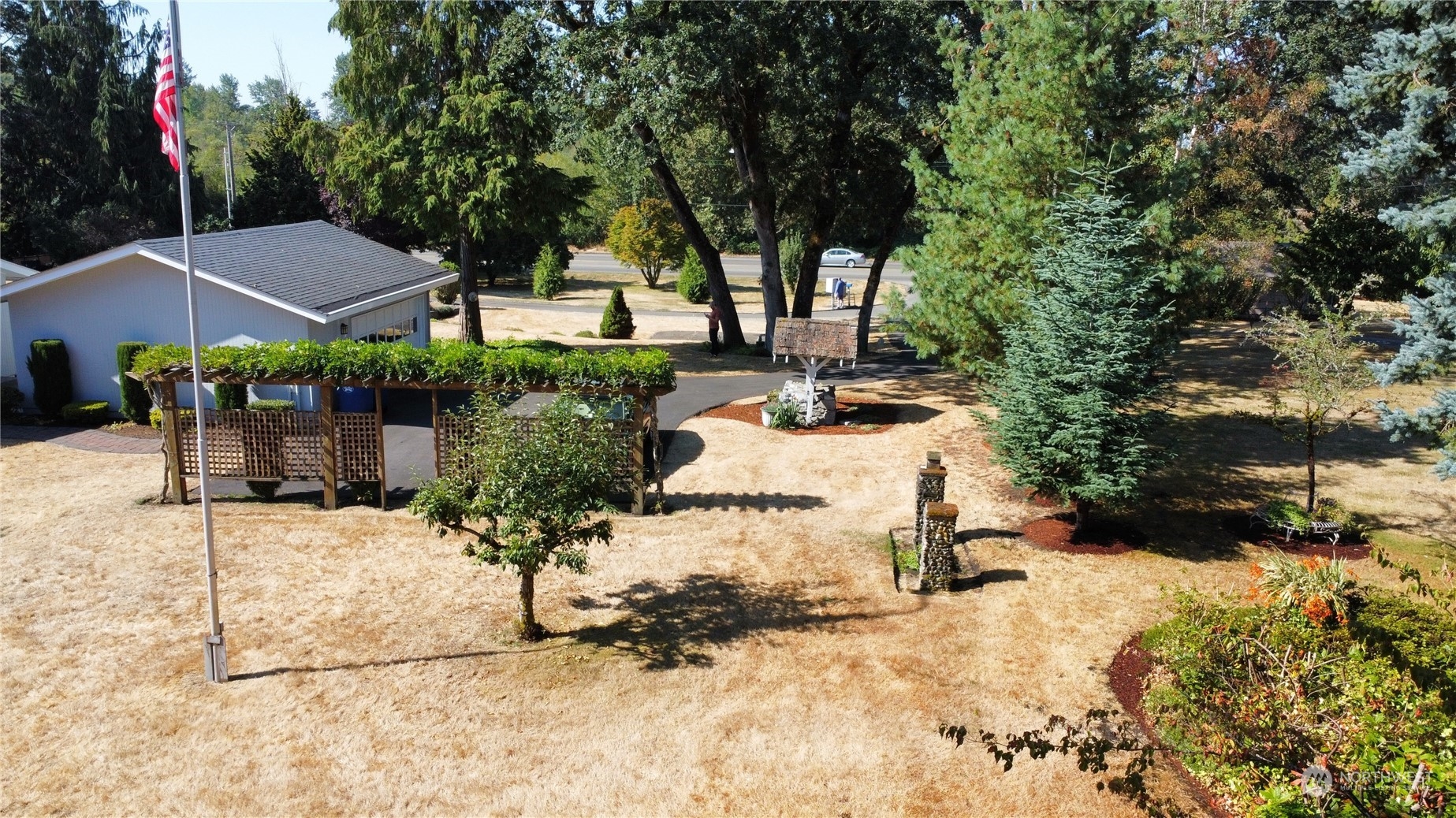 12823 Spanaway Loop Road South Tacoma, WA 98444 - Photo 32 of 38 a view of a house with yard and tree s