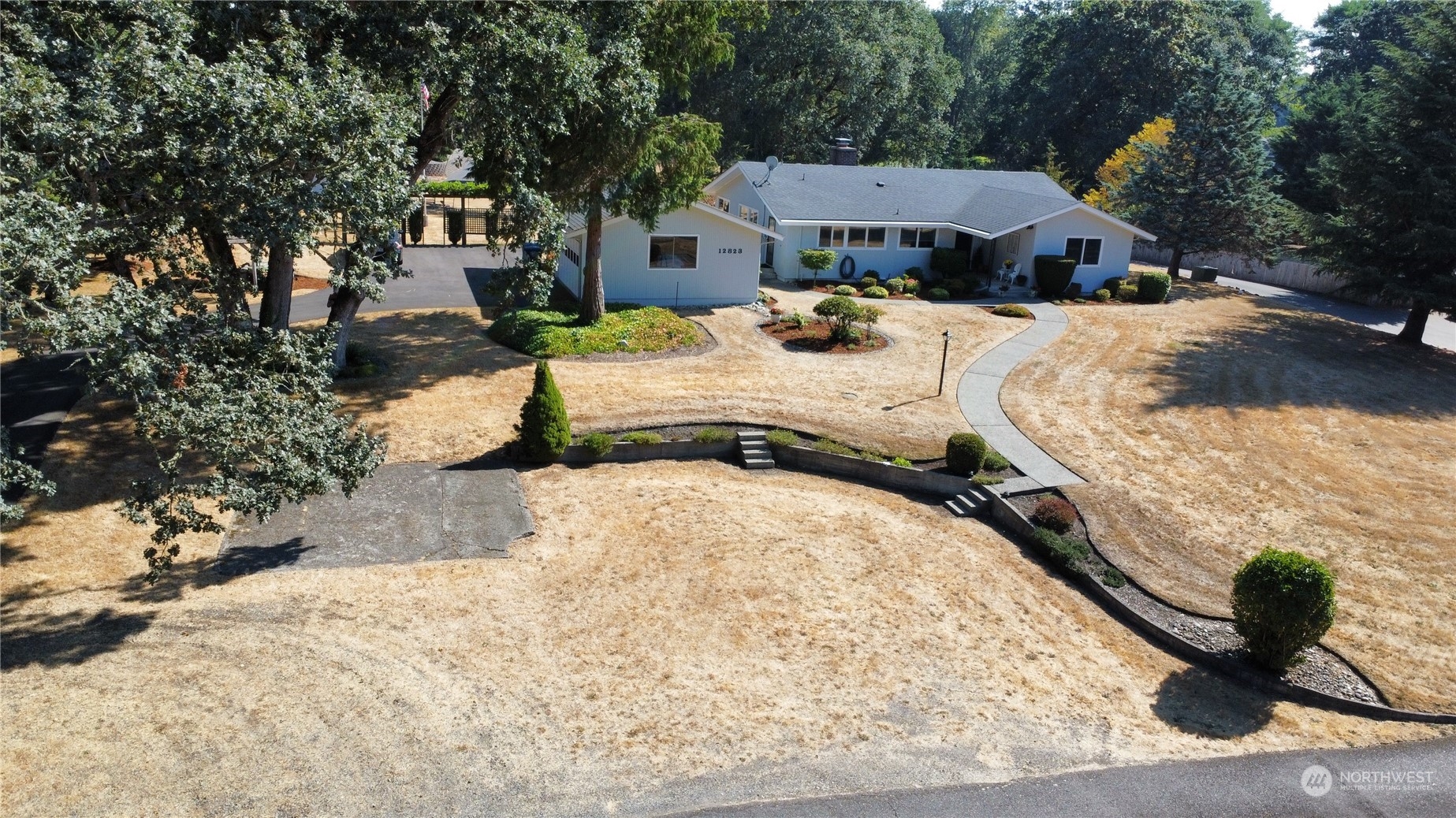12823 Spanaway Loop Road South Tacoma, WA 98444 - Photo 35 of 38 a view of a backyard of the house