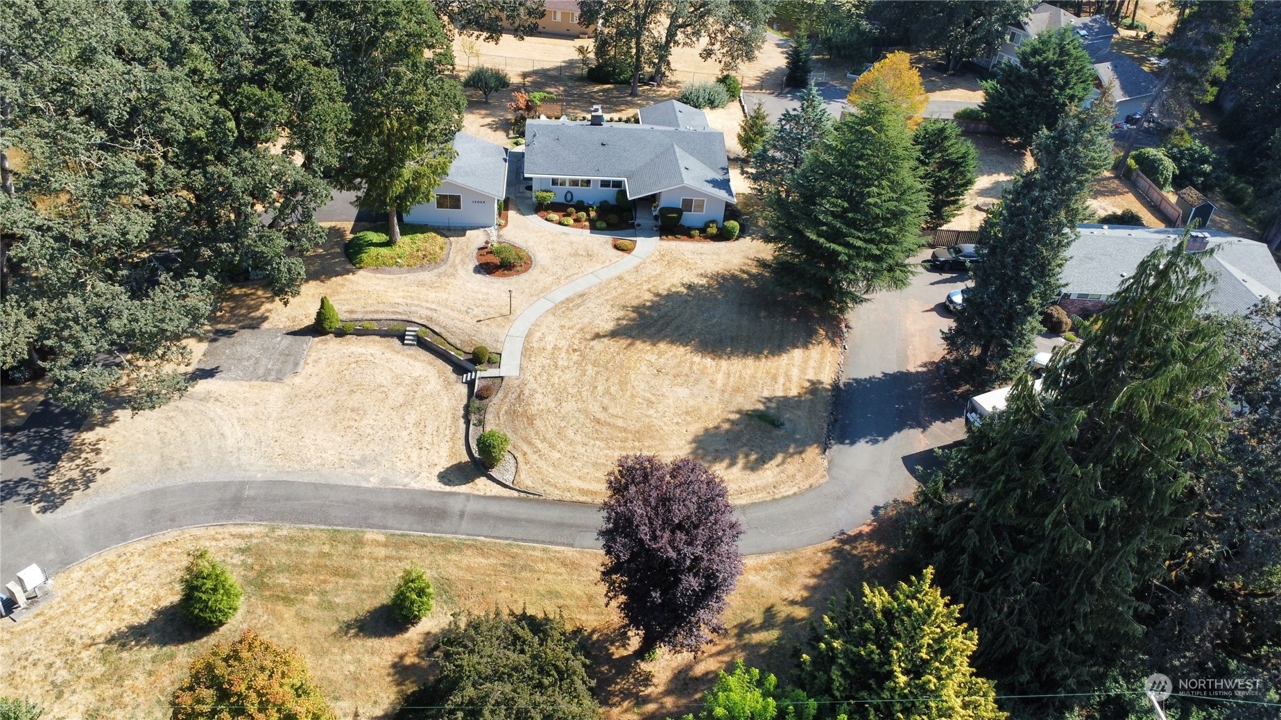 12823 Spanaway Loop Road South Tacoma, WA 98444 - Photo 37 of 38 a view of a swimming pool with a yard