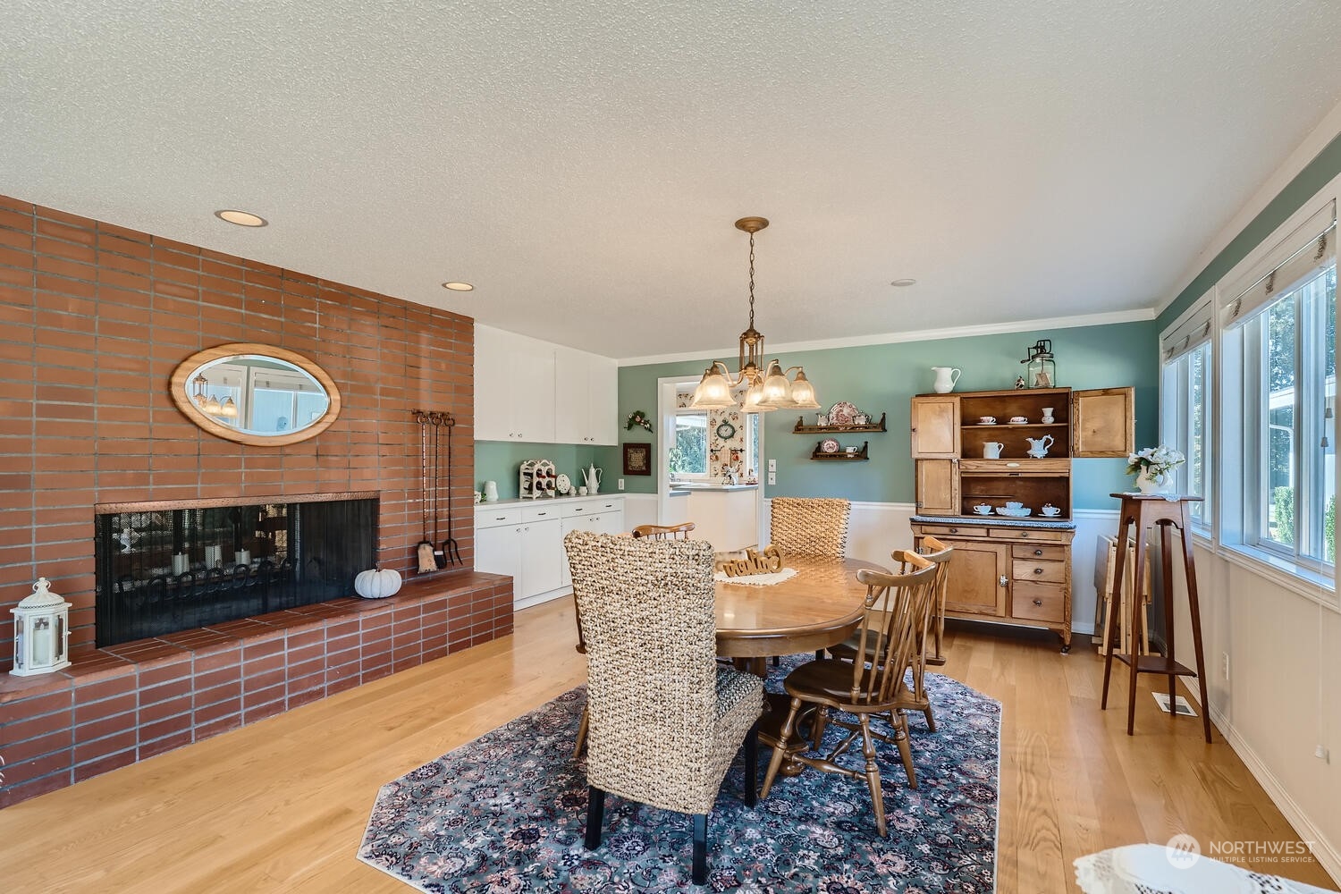 12823 Spanaway Loop Road South Tacoma, WA 98444 - Photo 8 of 38 a dining room with furniture and wooden floor