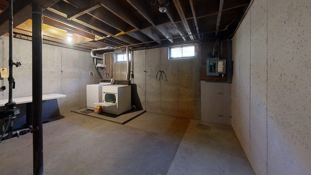 127 Marion Road Rochester, MA 02770 - Photo 17 of 26 a view of a storage room washer and dryer
