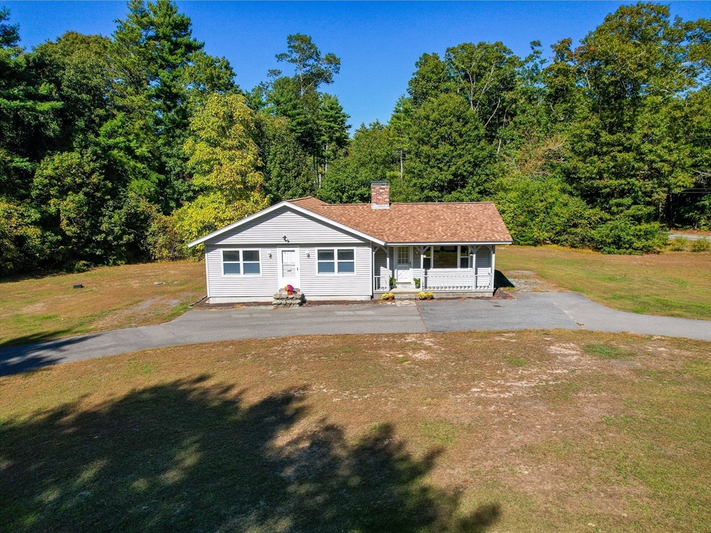127 Marion Road Rochester, MA 02770 - Photo 3 of 26 a front view of a house with garden