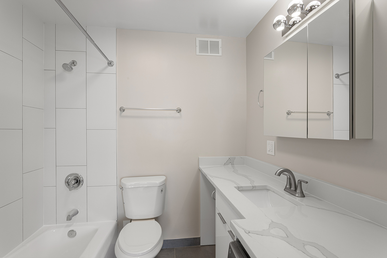 6166 North Sheridan Road, Unit 22B Chicago, IL 60660 - Photo 12 of 18 a bathroom with a sink toilet and shower