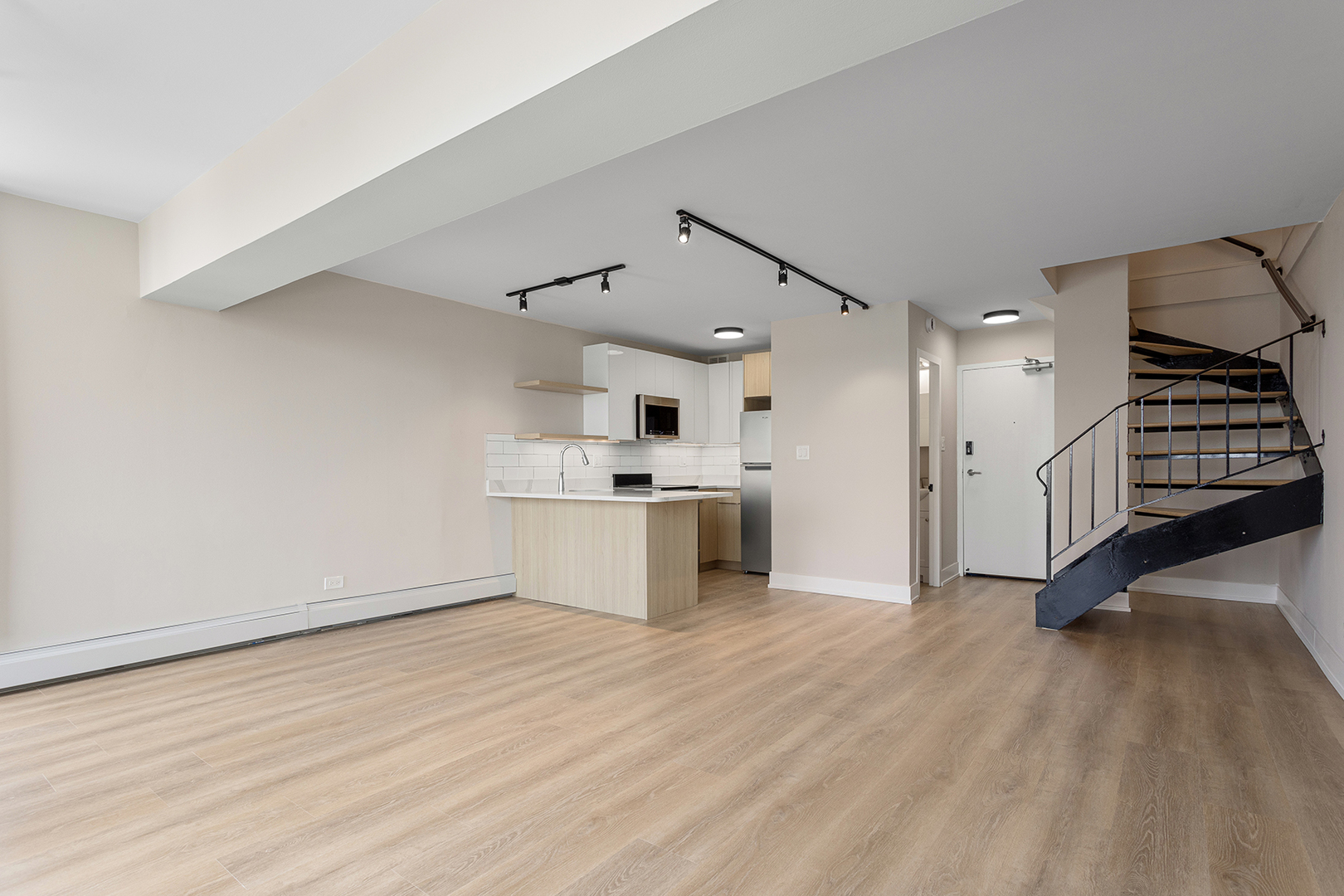 6166 North Sheridan Road, Unit 22B Chicago, IL 60660 - Photo 5 of 18 a view of kitchen with stainless steel appliances cabinets and wooden floor