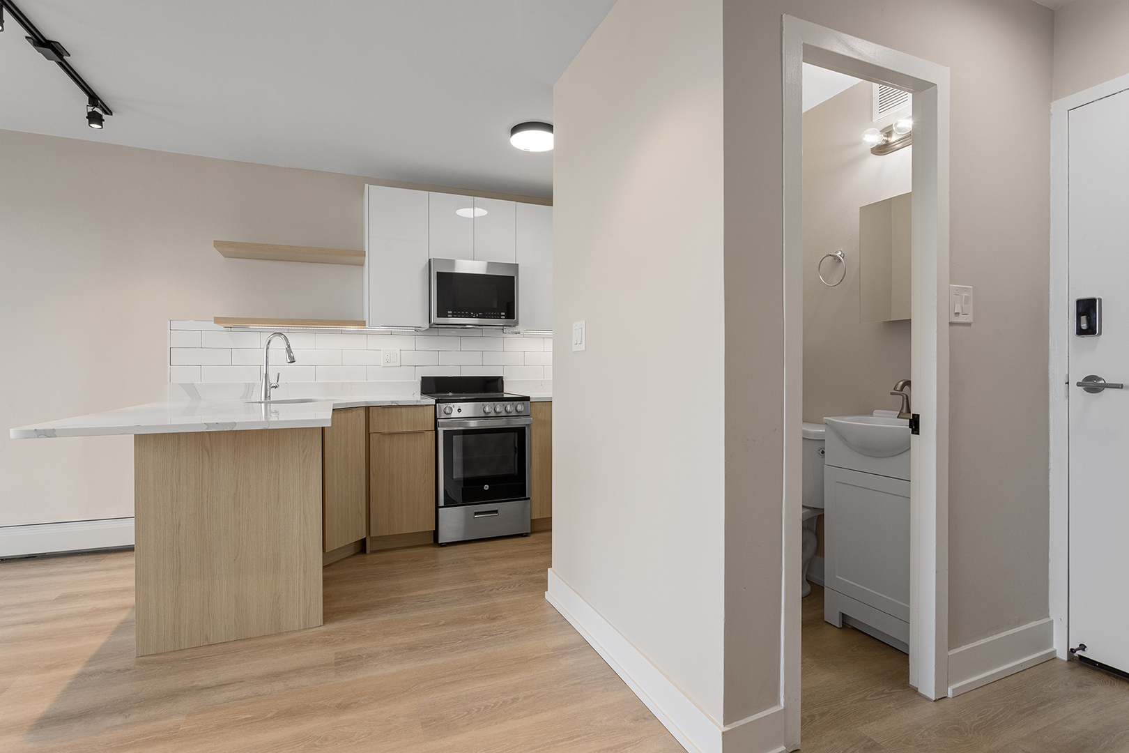 6166 North Sheridan Road, Unit 22B Chicago, IL 60660 - Photo 8 of 18 a kitchen with a sink cabinets and stainless steel appliances
