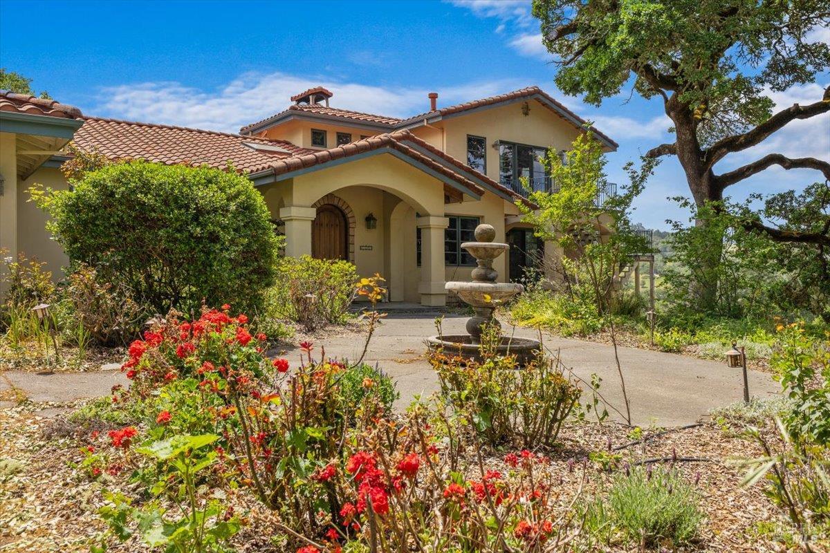 13404 Flora Ranch Road Healdsburg, CA 95448 - Photo 17 of 66 a front view of a house with a yard