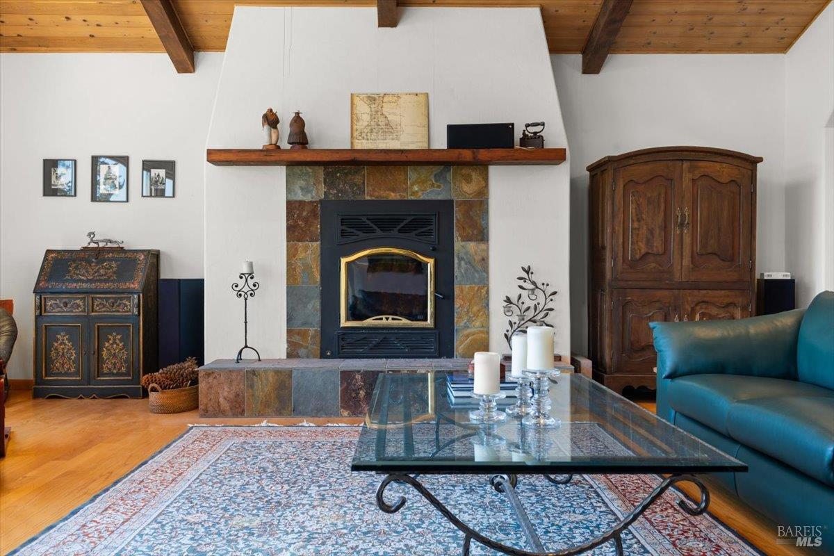 13404 Flora Ranch Road Healdsburg, CA 95448 - Photo 24 of 66 a living room with furniture and a fireplace