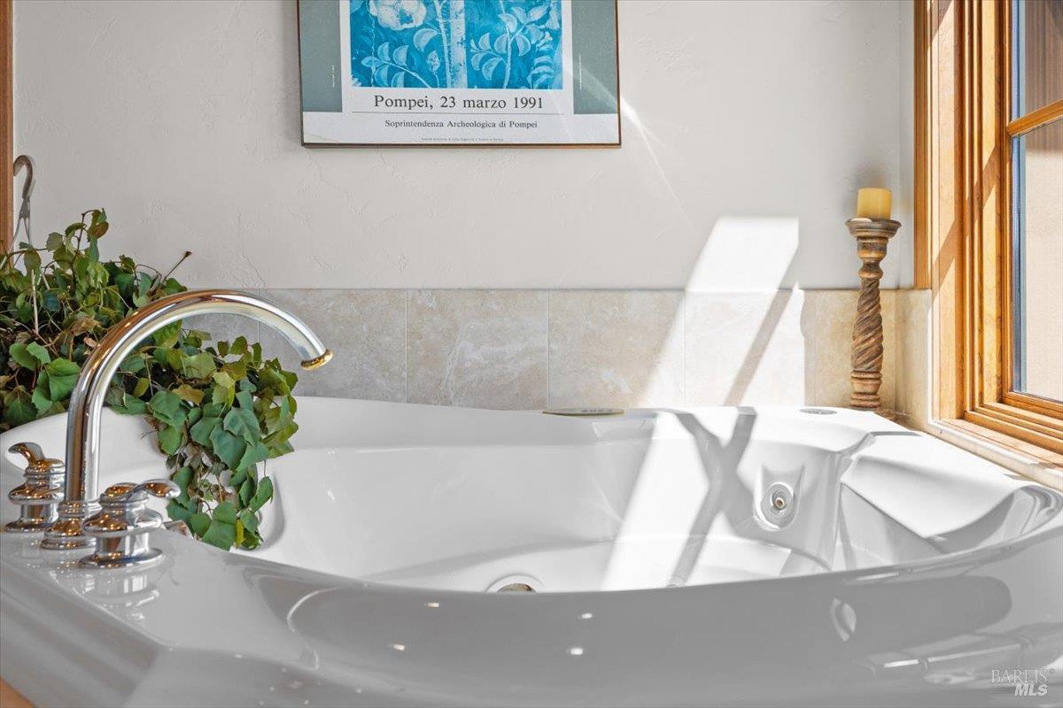 13404 Flora Ranch Road Healdsburg, CA 95448 - Photo 36 of 66 a view of a bath tub sitting in a bathroom