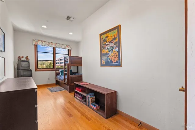 a room with furniture pool table and windows
