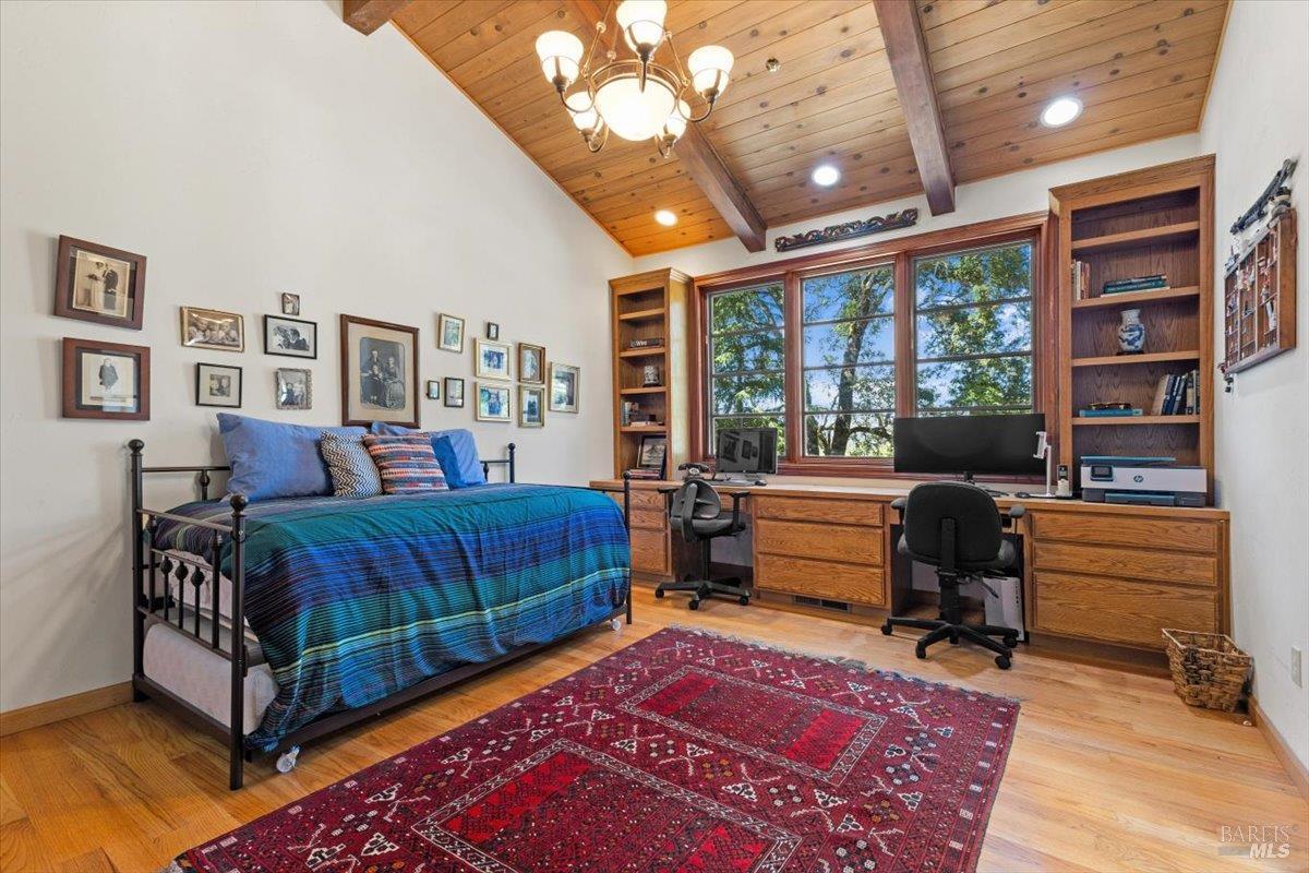 13404 Flora Ranch Road Healdsburg, CA 95448 - Photo 40 of 66 a bedroom with furniture and a rug