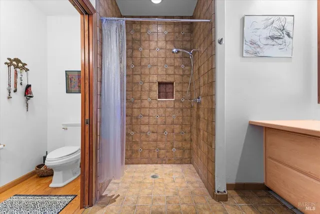 a view of a patio with table and chairs and potted plants