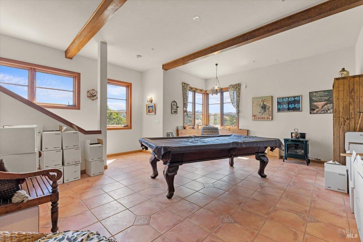 13404 Flora Ranch Road Healdsburg, CA 95448 - Photo 49 of 66 a room with furniture pool table and windows