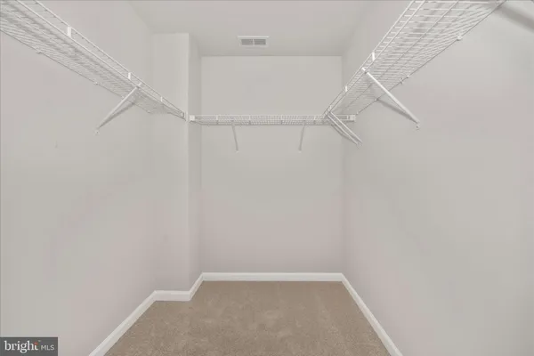 a view of small space with racks on the wall