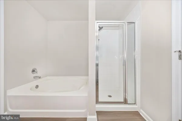 a white bath tub sitting next to a window