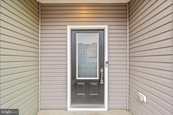 a view of a door and a window