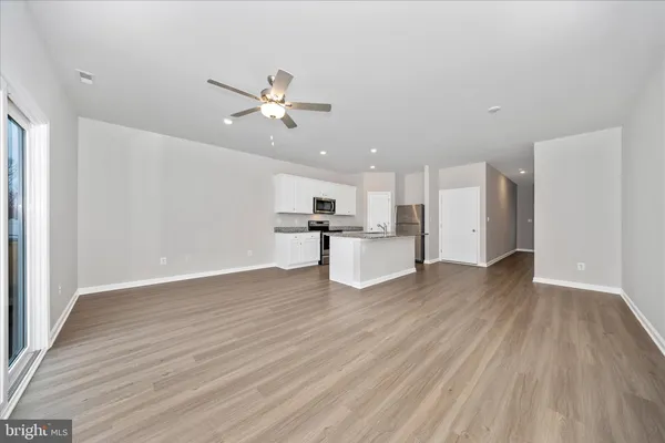 a view of kitchen with wooden floor and window