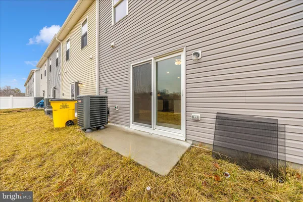 a view of a house with snow on the road