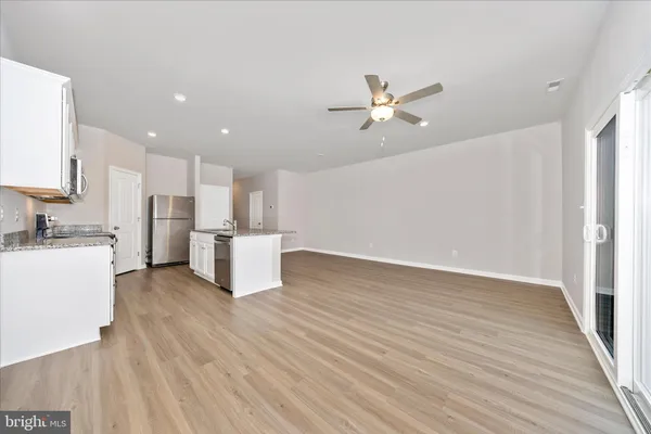 a view of kitchen with wooden floor and window