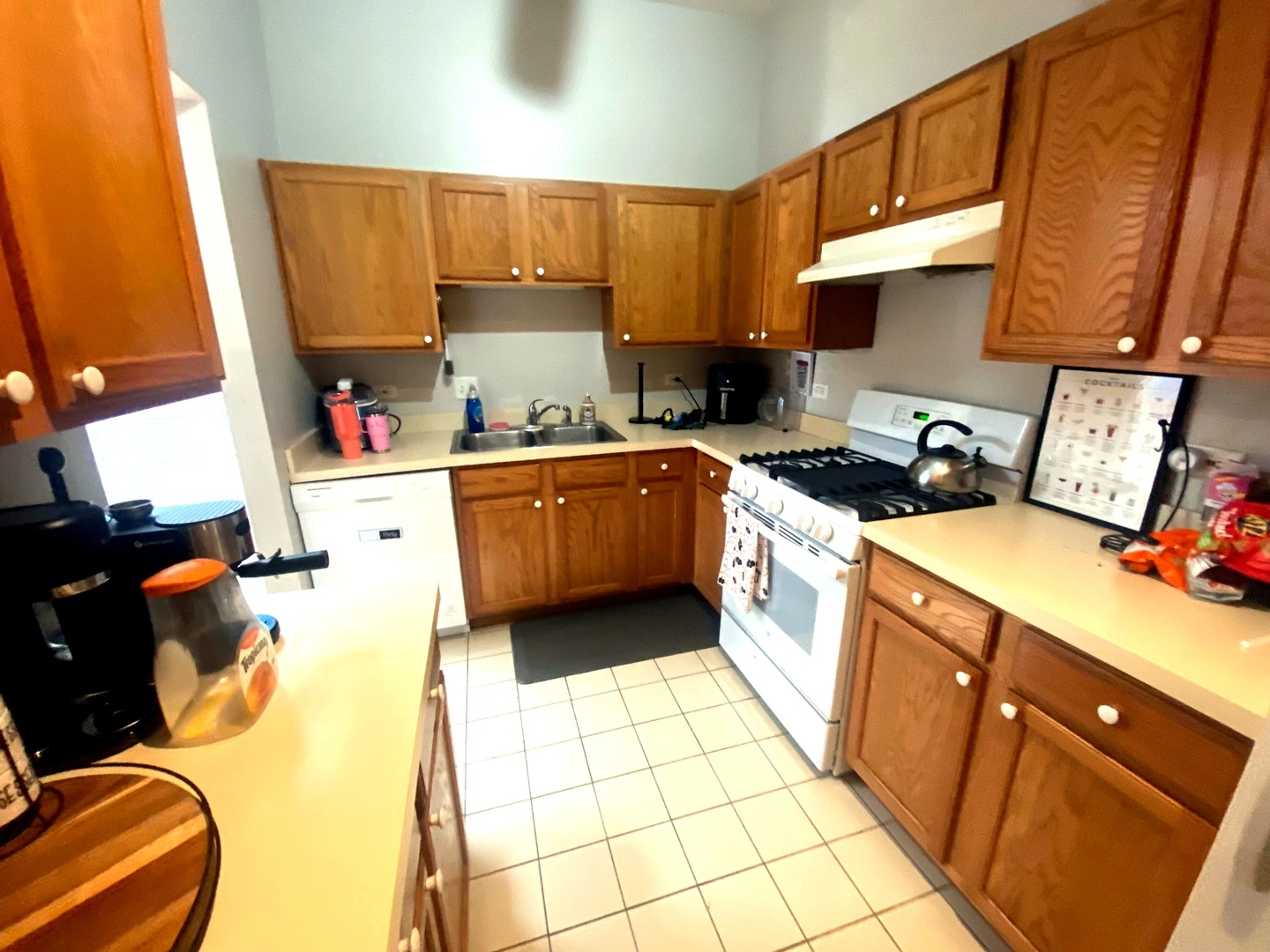1100 South State Street Lockport, IL 60441 - Photo 13 of 18 a kitchen with a sink appliances and cabinets