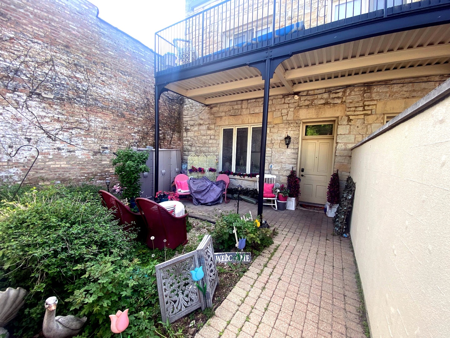 1100 South State Street Lockport, IL 60441 - Photo 9 of 18 a view of a porch with furniture and potted plants