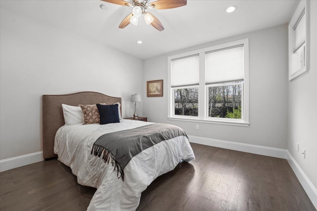2-4 Elm Street, Unit 2B Boston, MA 02122 - Photo 15 of 27 a bedroom with a large bed and a window