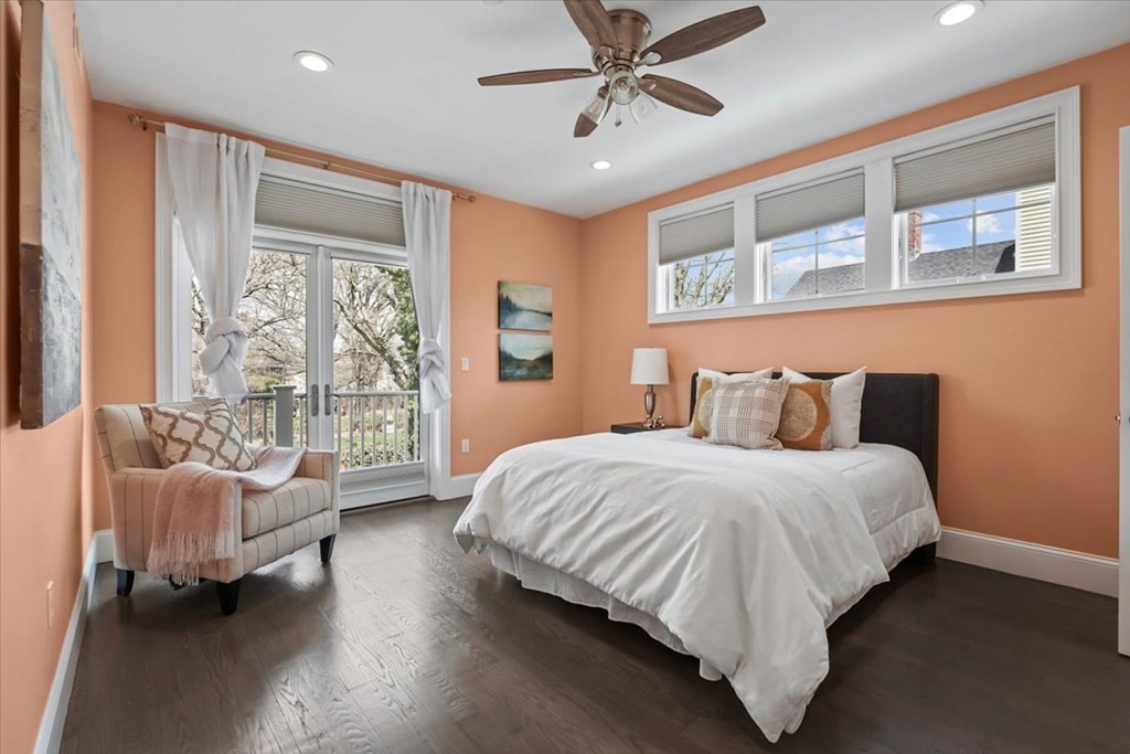 2-4 Elm Street, Unit 2B Boston, MA 02122 - Photo 19 of 27 a spacious bedroom with a bed couch and a window
