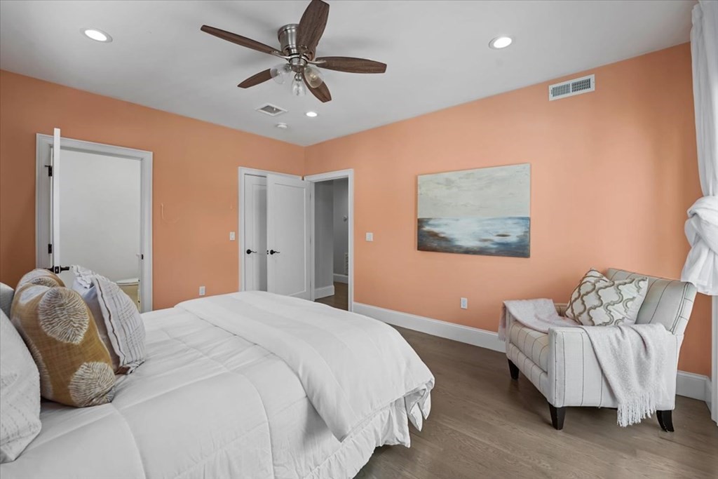 2-4 Elm Street, Unit 2B Boston, MA 02122 - Photo 20 of 27 a bedroom with a bed and a couch