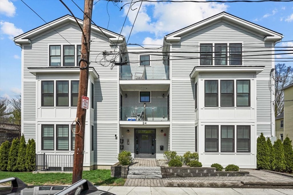2-4 Elm Street, Unit 2B Boston, MA 02122 - Photo 2 of 27 a front view of a house with garden