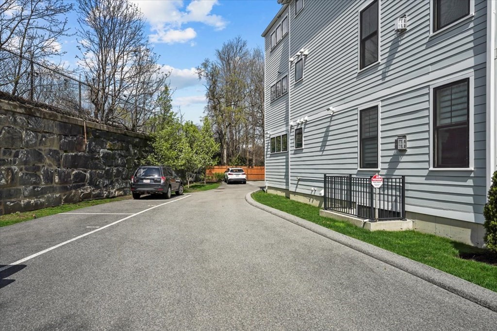 2-4 Elm Street, Unit 2B Boston, MA 02122 - Photo 25 of 27 a view of a house with a yard