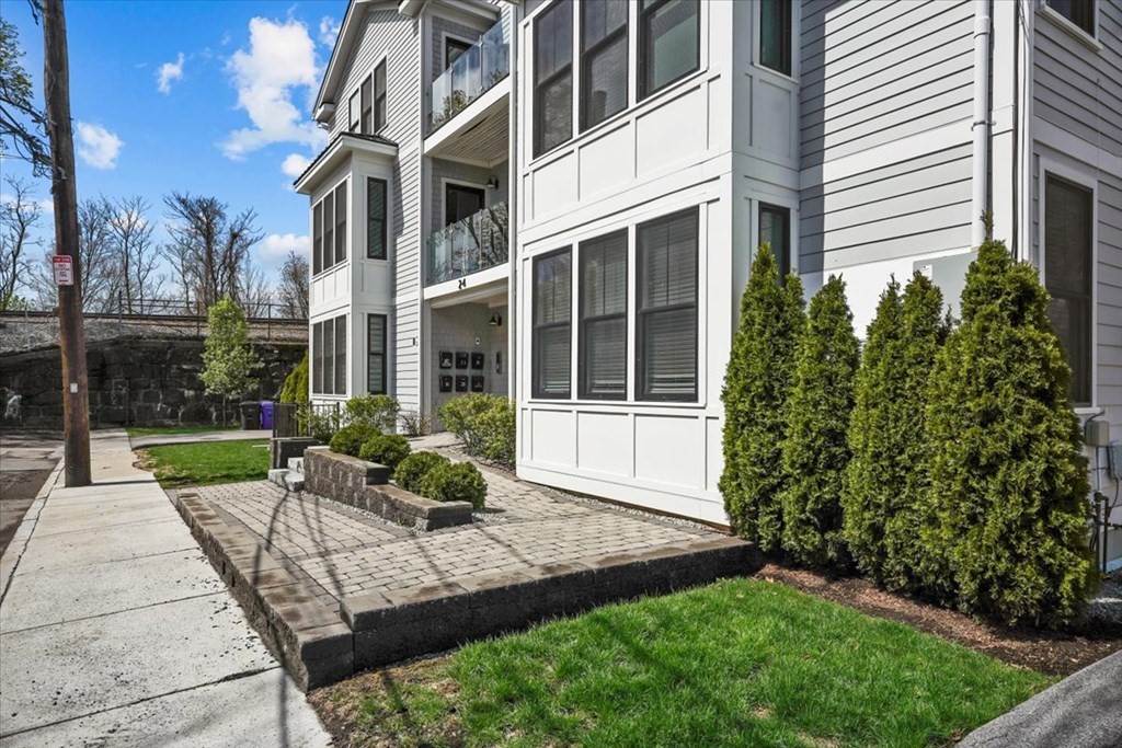 2-4 Elm Street, Unit 2B Boston, MA 02122 - Photo 26 of 27 a view of a house with backyard sitting area and garden