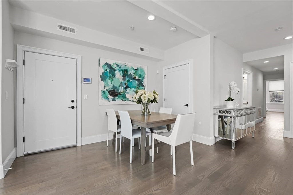 2-4 Elm Street, Unit 2B Boston, MA 02122 - Photo 6 of 27 a dining room with furniture and wooden floor