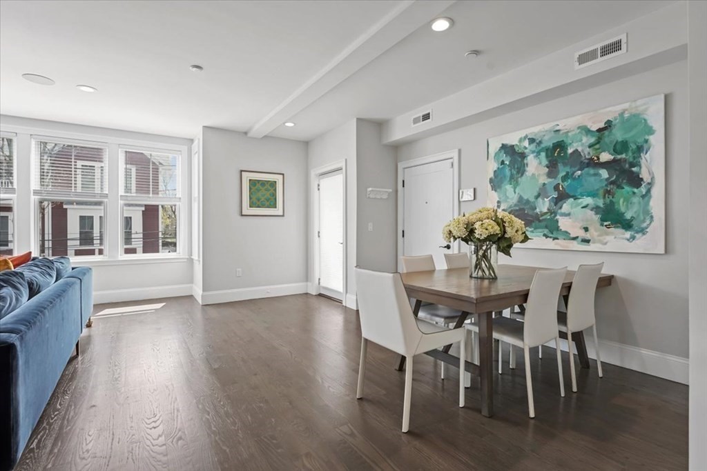 2-4 Elm Street, Unit 2B Boston, MA 02122 - Photo 7 of 27 a view of a dining room with furniture window and wooden floor