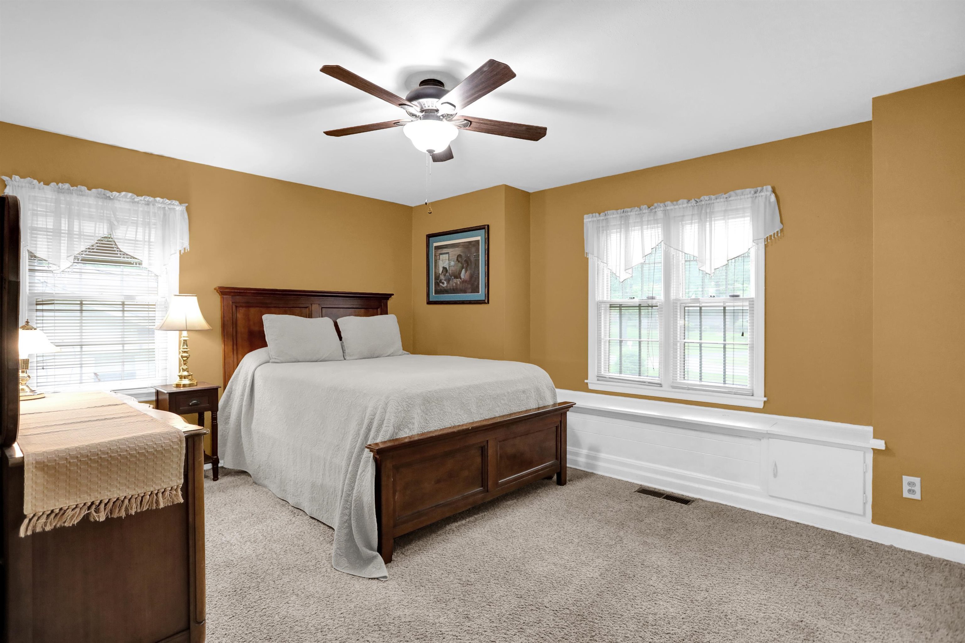 1277 Old Hickory Road Memphis, TN 38116 - Photo 18 of 29 Bedroom featuring multiple windows, a ceiling fan, light colored carpet, and visible vents