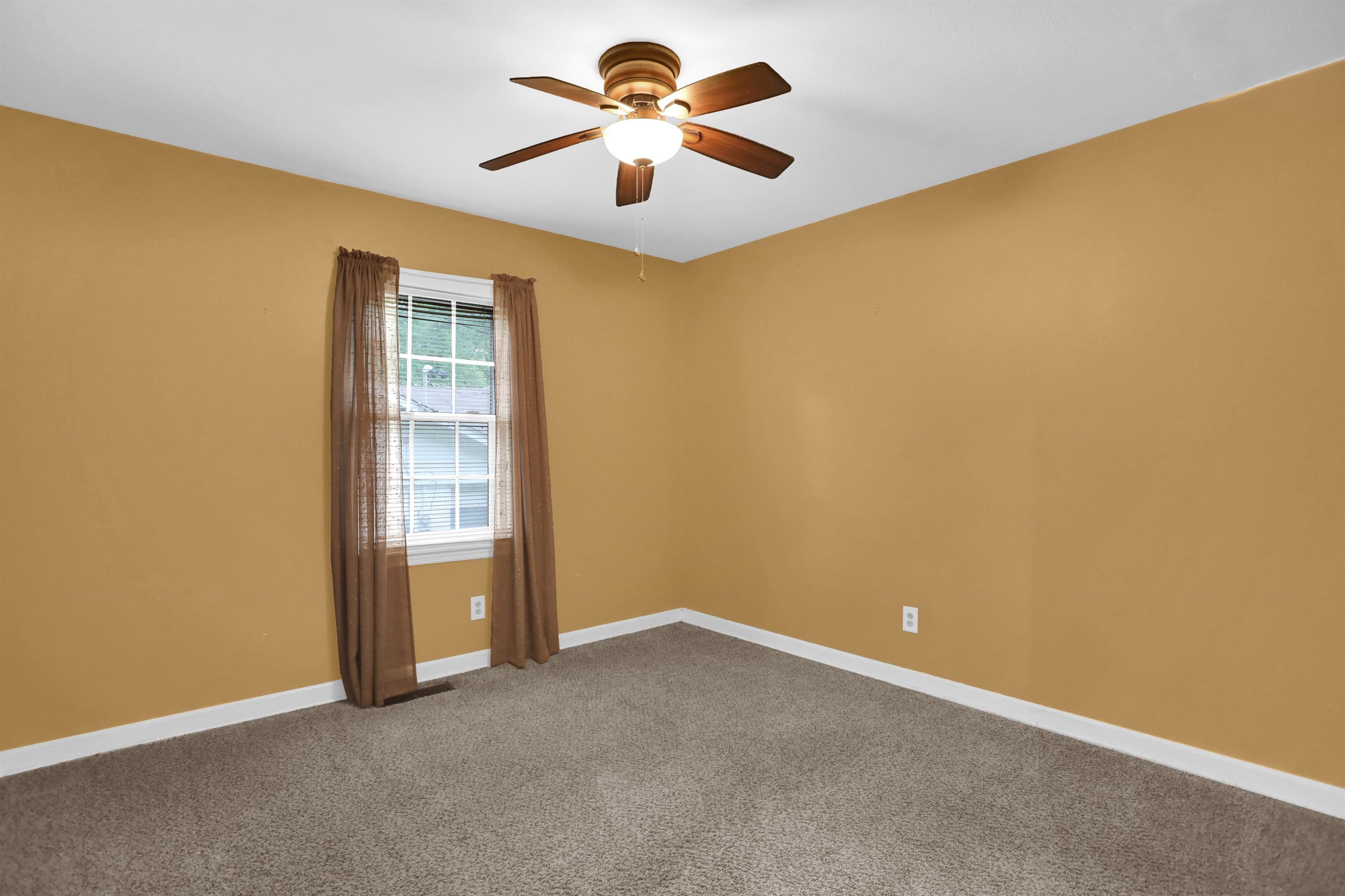 1277 Old Hickory Road Memphis, TN 38116 - Photo 19 of 29 Empty room featuring ceiling fan, baseboards, and carpet