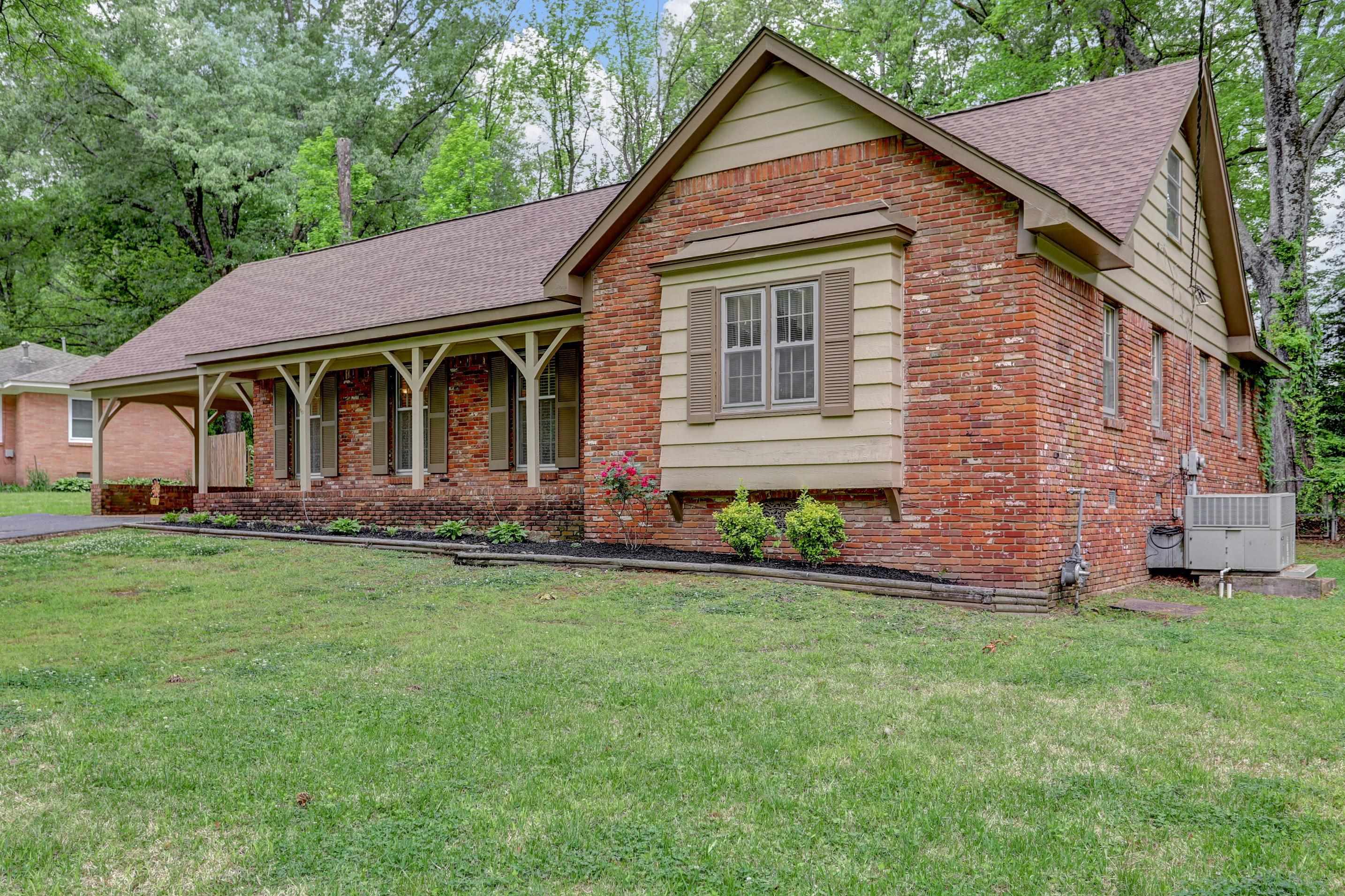 1277 Old Hickory Road Memphis, TN 38116 - Photo 2 of 29 Single story home featuring brick siding, roof with shingles, and a front lawn