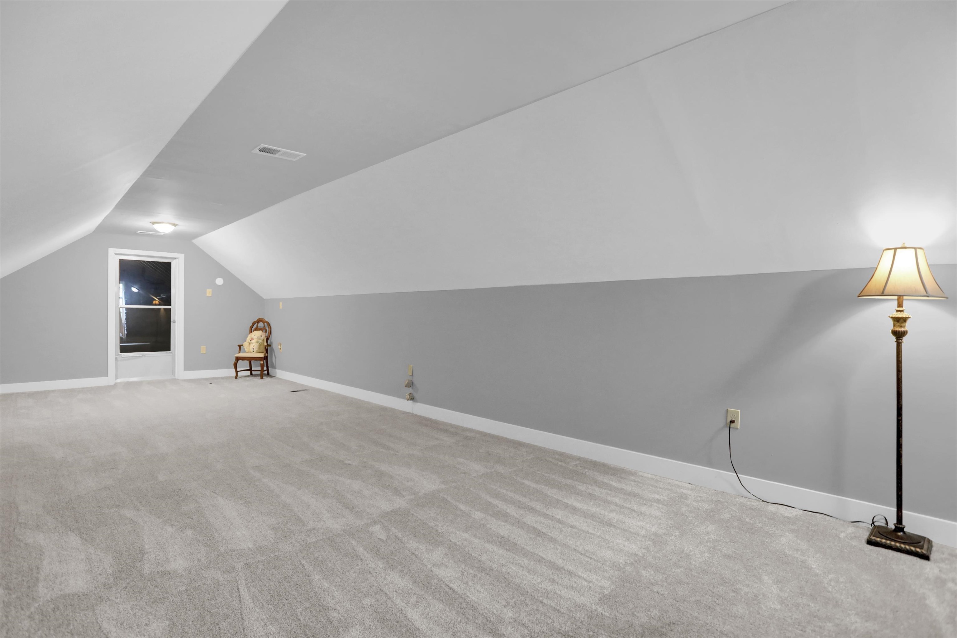 1277 Old Hickory Road Memphis, TN 38116 - Photo 23 of 29 Bonus room featuring carpet floors, baseboards, vaulted ceiling, and visible vents