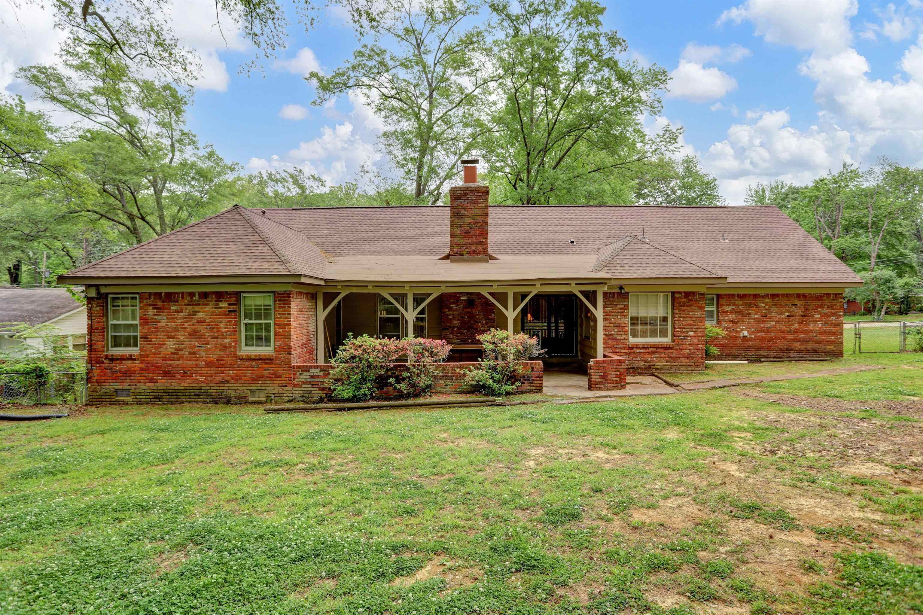 1277 Old Hickory Road Memphis, TN 38116 - Photo 3 of 29 Rear view of property with a yard, brick siding, and fence
