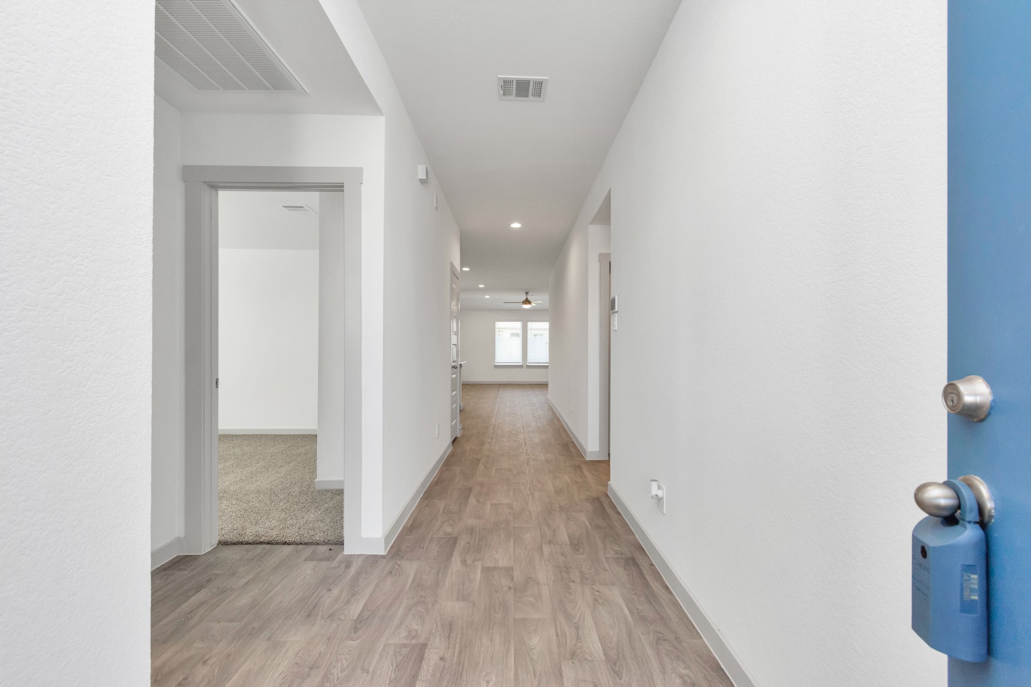 10626 Watershed Drive Rosharon, TX 77583 - Photo 13 of 42 a view of a hallway with wooden floor
