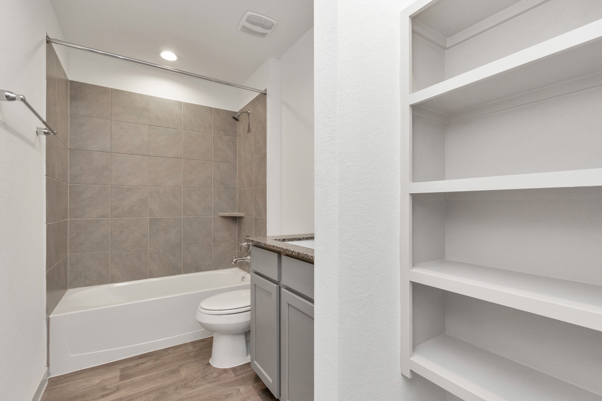 10626 Watershed Drive Rosharon, TX 77583 - Photo 16 of 42 a bathroom with a toilet and a bathtub