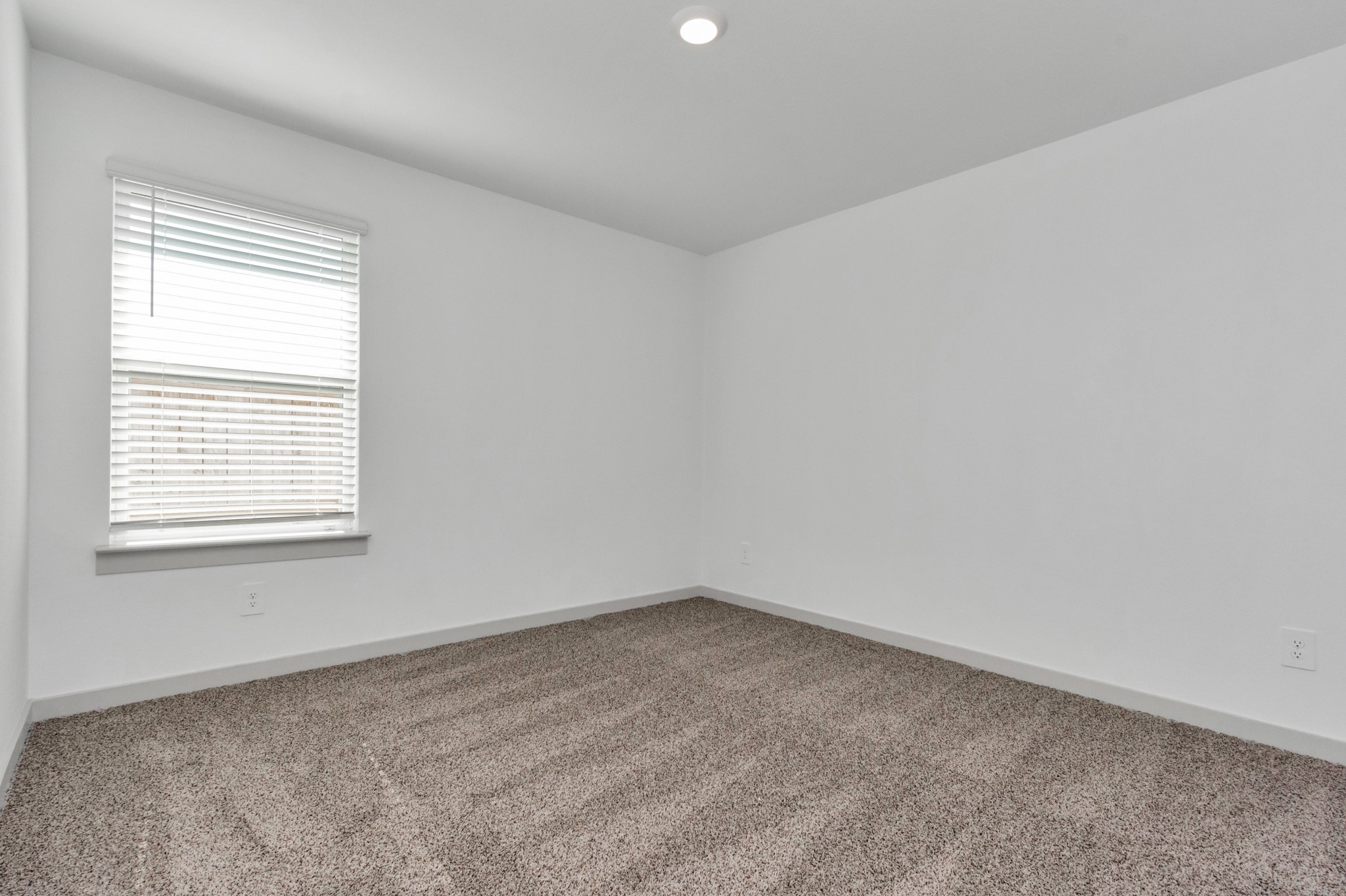 10626 Watershed Drive Rosharon, TX 77583 - Photo 17 of 42 an empty room with a window
