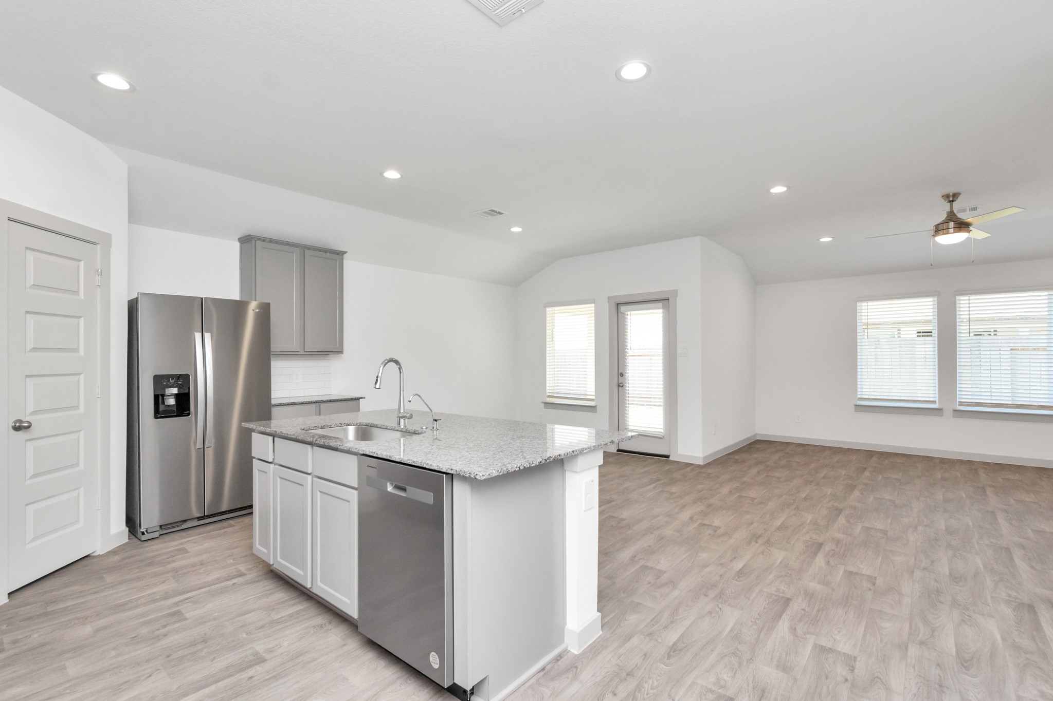 10626 Watershed Drive Rosharon, TX 77583 - Photo 23 of 42 a kitchen with stainless steel appliances a refrigerator sink and cabinets