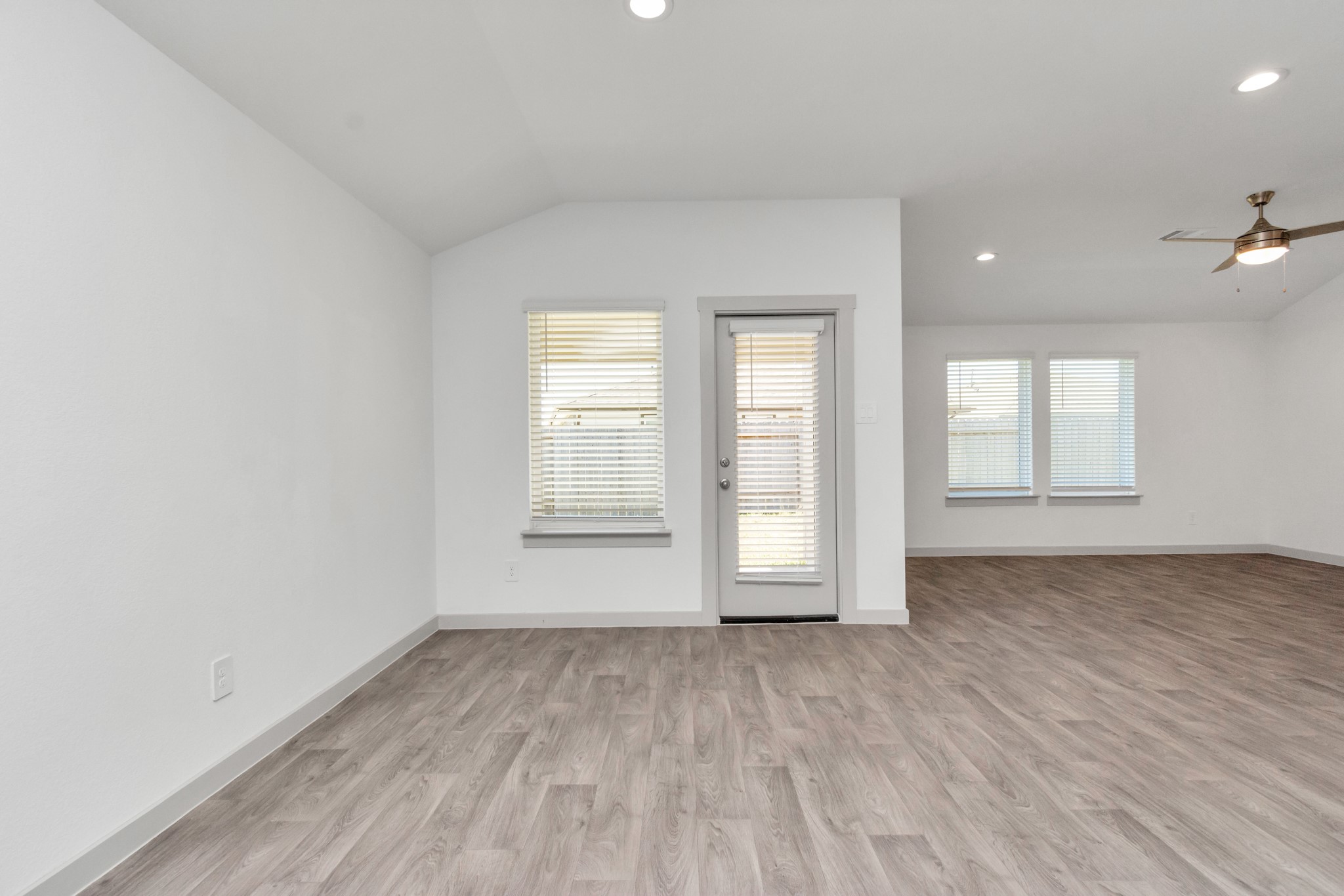 10626 Watershed Drive Rosharon, TX 77583 - Photo 29 of 42 an empty room with wooden floor and windows