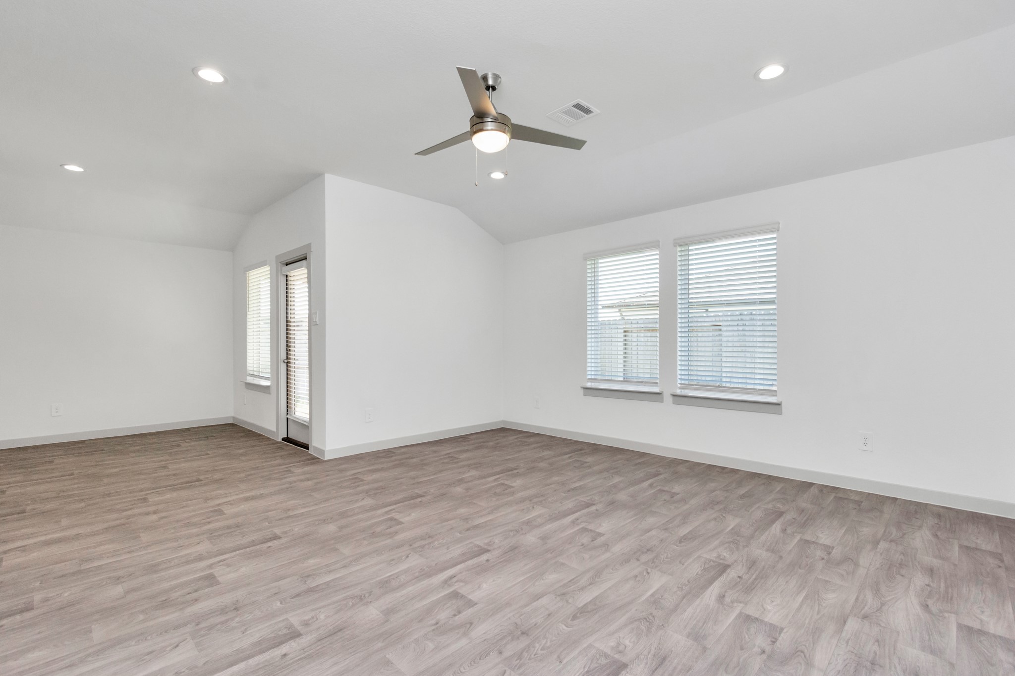 10626 Watershed Drive Rosharon, TX 77583 - Photo 34 of 42 wooden floor in an empty room with a window