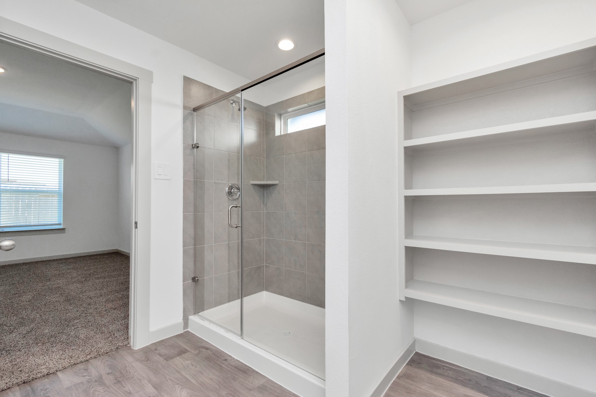 10626 Watershed Drive Rosharon, TX 77583 - Photo 40 of 42 a bathroom with a bathtub and a shower