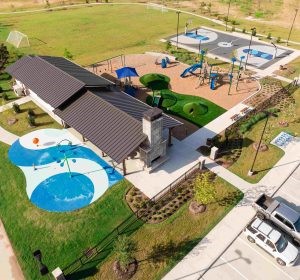 10626 Watershed Drive Rosharon, TX 77583 - Photo 4 of 42 an aerial view of a house with a garden and lake view