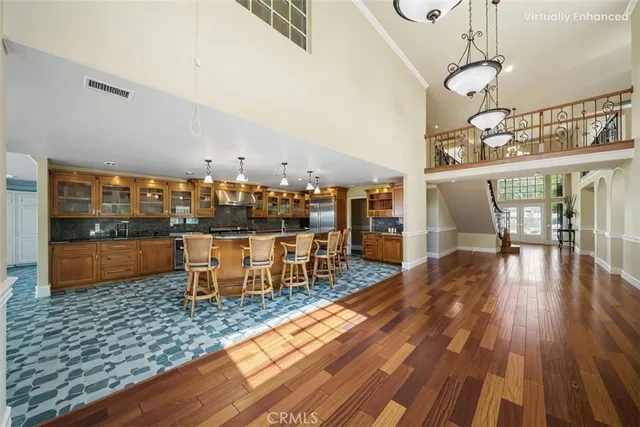 a dining room with furniture and wooden floor
